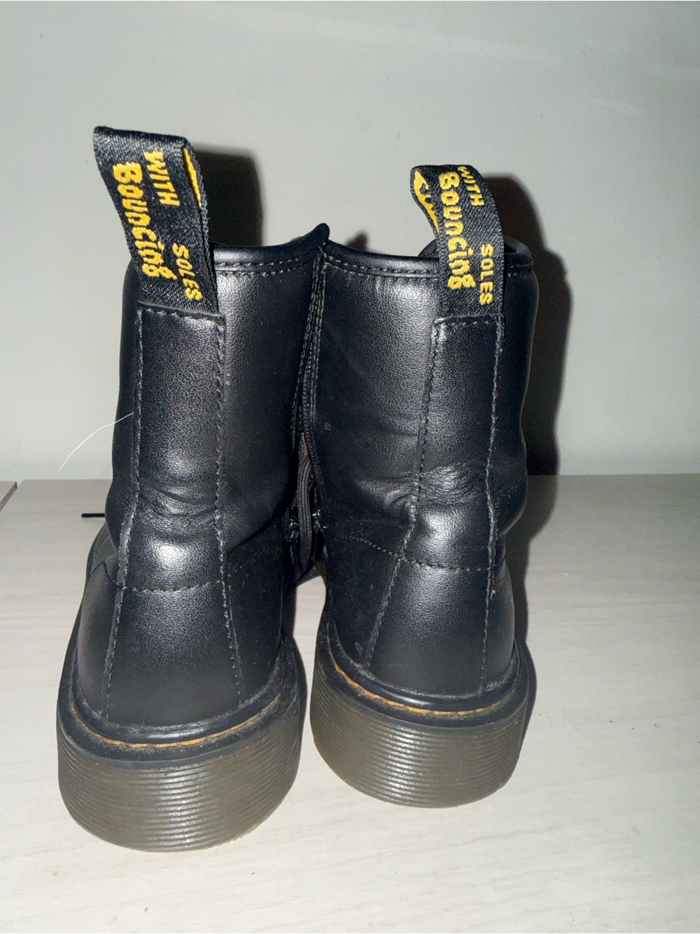 Dr. Martens Black Leather Ankle Boots with Yellow Pull Tabs